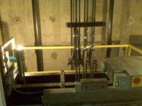 Fixed car top guard rail installed in an elevator hoistway
